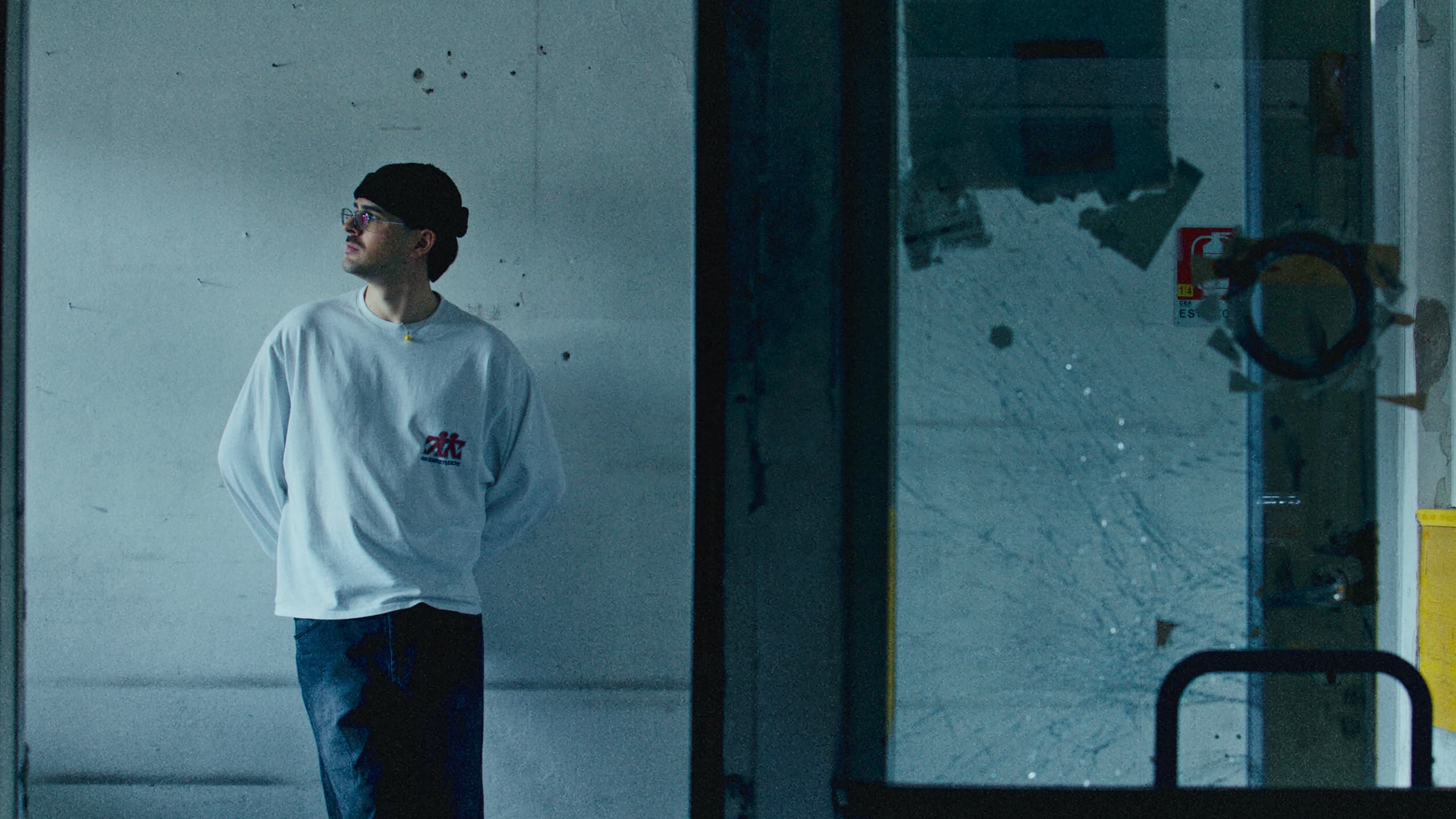 Fil Palmer in a doorway of a concrete building