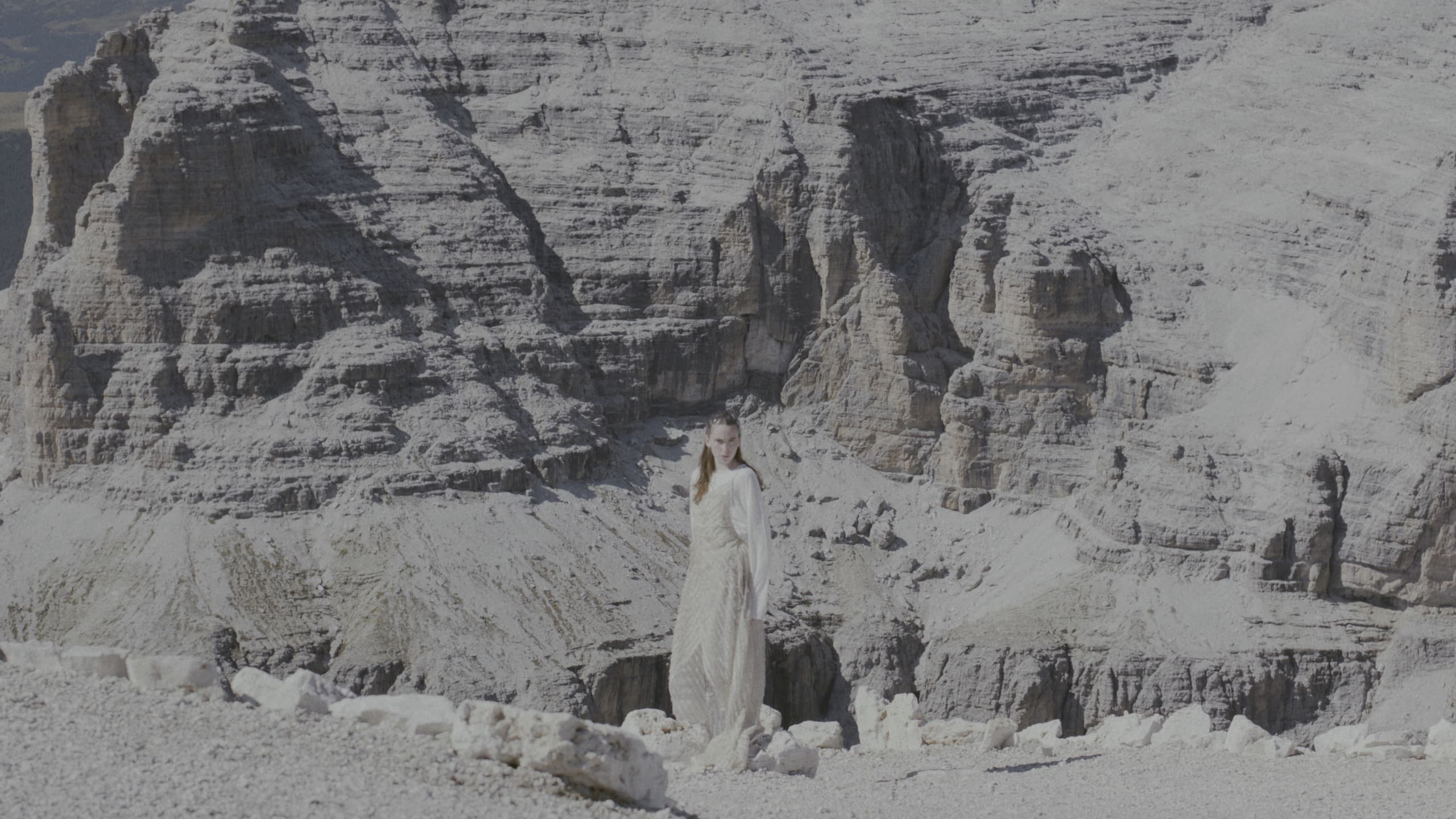 Ellen Larcher below the cliffs of the Dolomites
