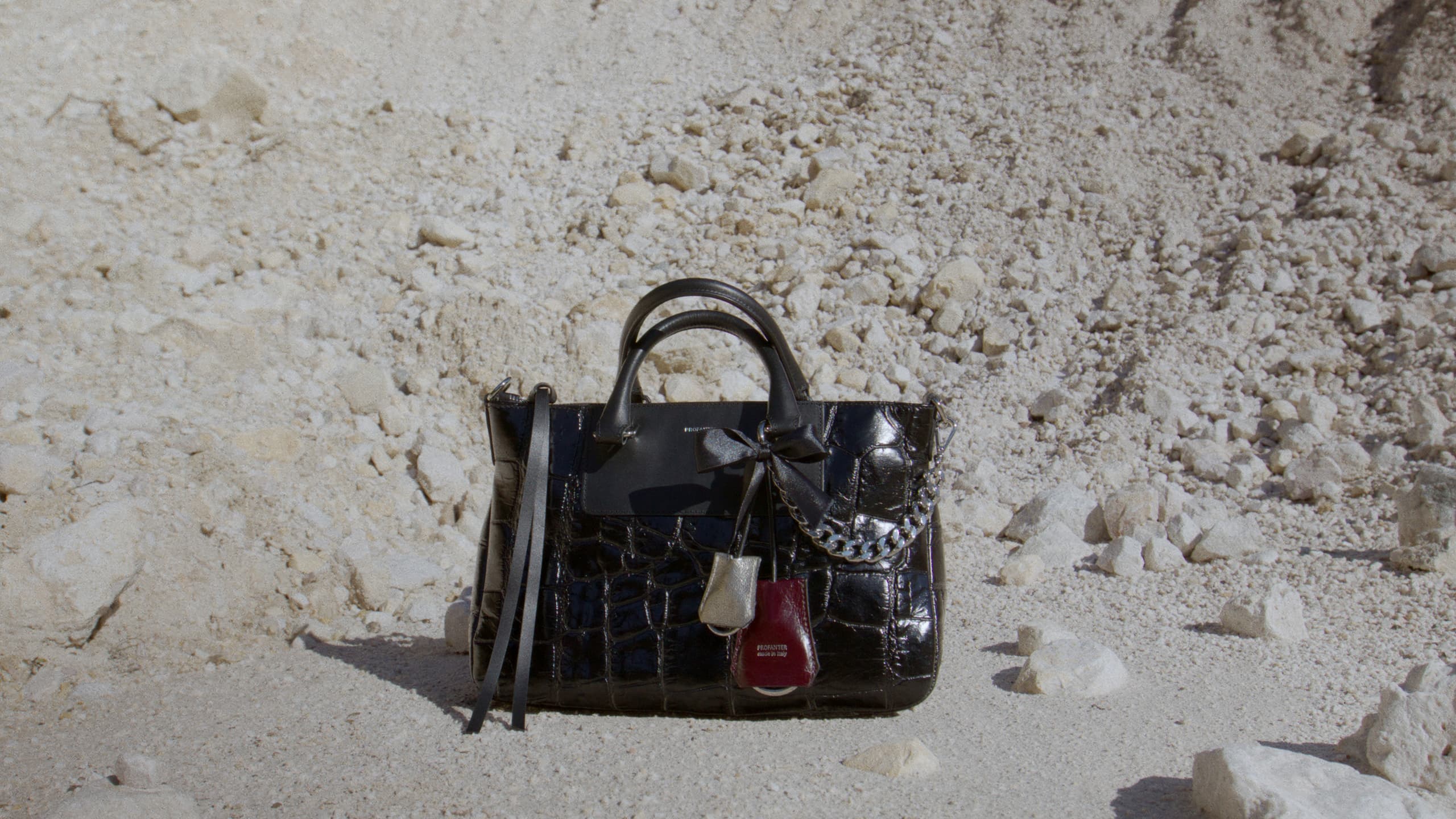 The LIV bag resting on pale rock